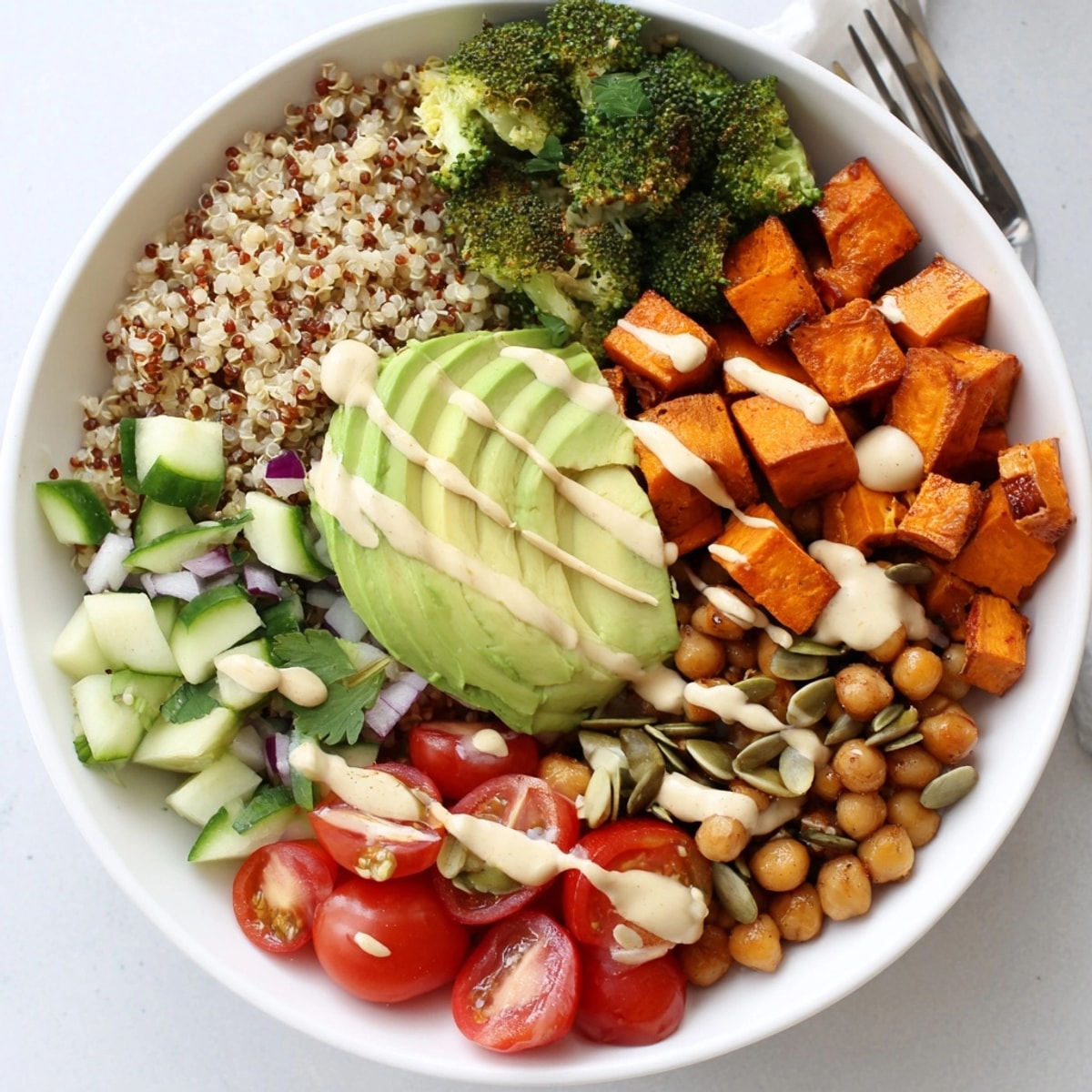 Overhead view of a colorful Global Grains Power Bowl, vibrant with fresh veggies.